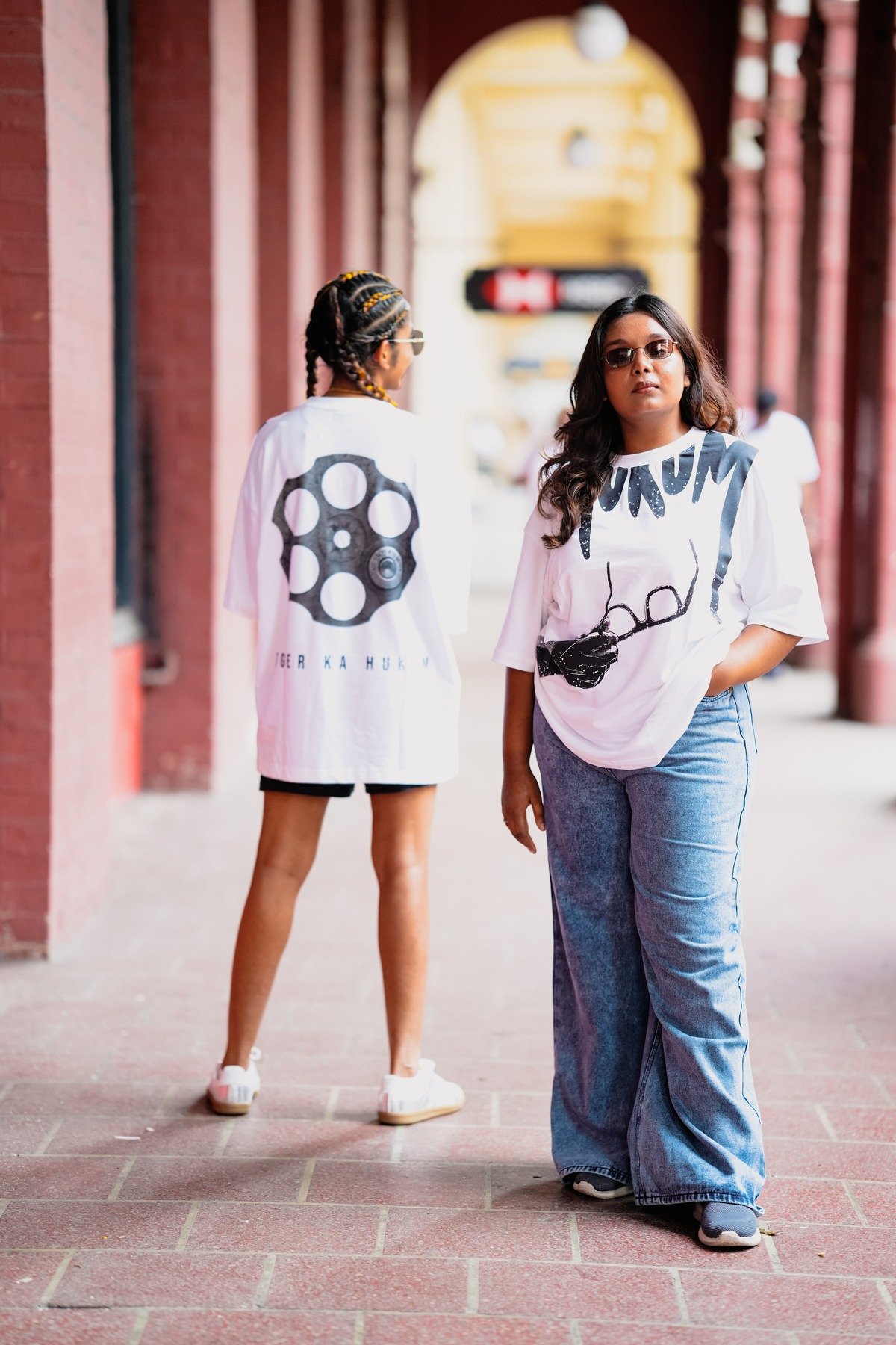 Look 01: Concrete Culture — SHARP.LK graphic white tees in urban architectural setting